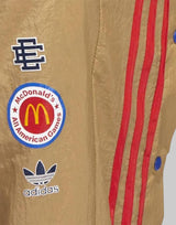 ADIDAS x Eric Eamnuel Crossover Stripe Basketball Pants Brown | MegaMall.bg